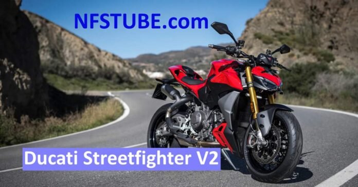A bright red Ducati Streetfighter V2 parked on a winding mountain road, showcasing its aggressive design, upside-down forks and premium performance stance.