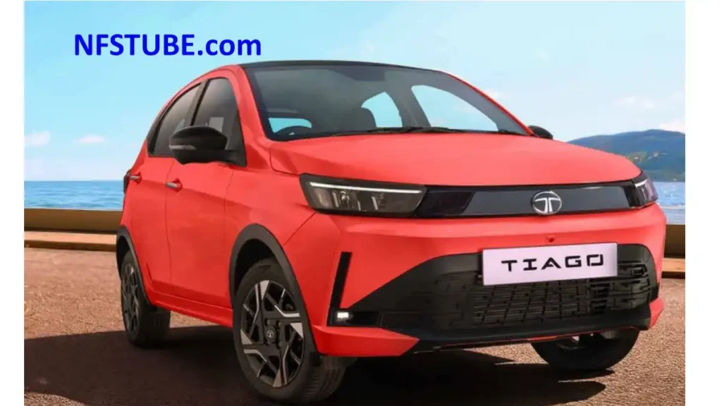 2026 Tata Tiago hatchback in red showcasing the updated front design, new styling elements, alloy wheels, and refreshed exterior launched in India.